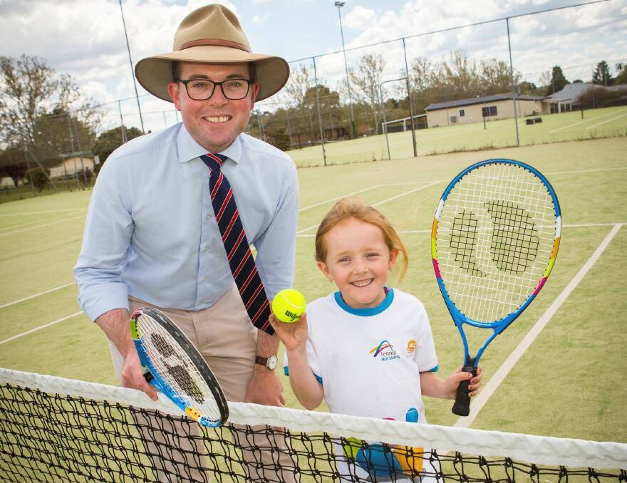 ACTIVE: Member for Northern Tablelands Adam Marshall get a tennis lesson from a much younger opponent.