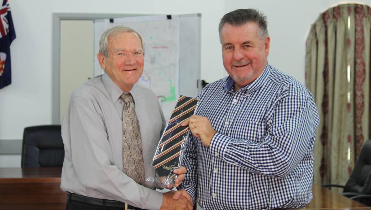 ELECTED: Cr Tom O'Connor was presented with a Uralla shire tie by Mayor Michael Pearce.