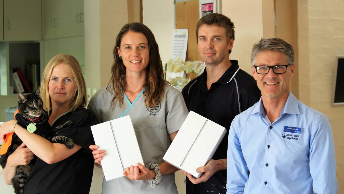 WINNERS: Dr Emma Billing with "Robbo", Dr Lucy Ducat, Armidale pet owner and iPad winner Kol Barratt and Laurence Price.