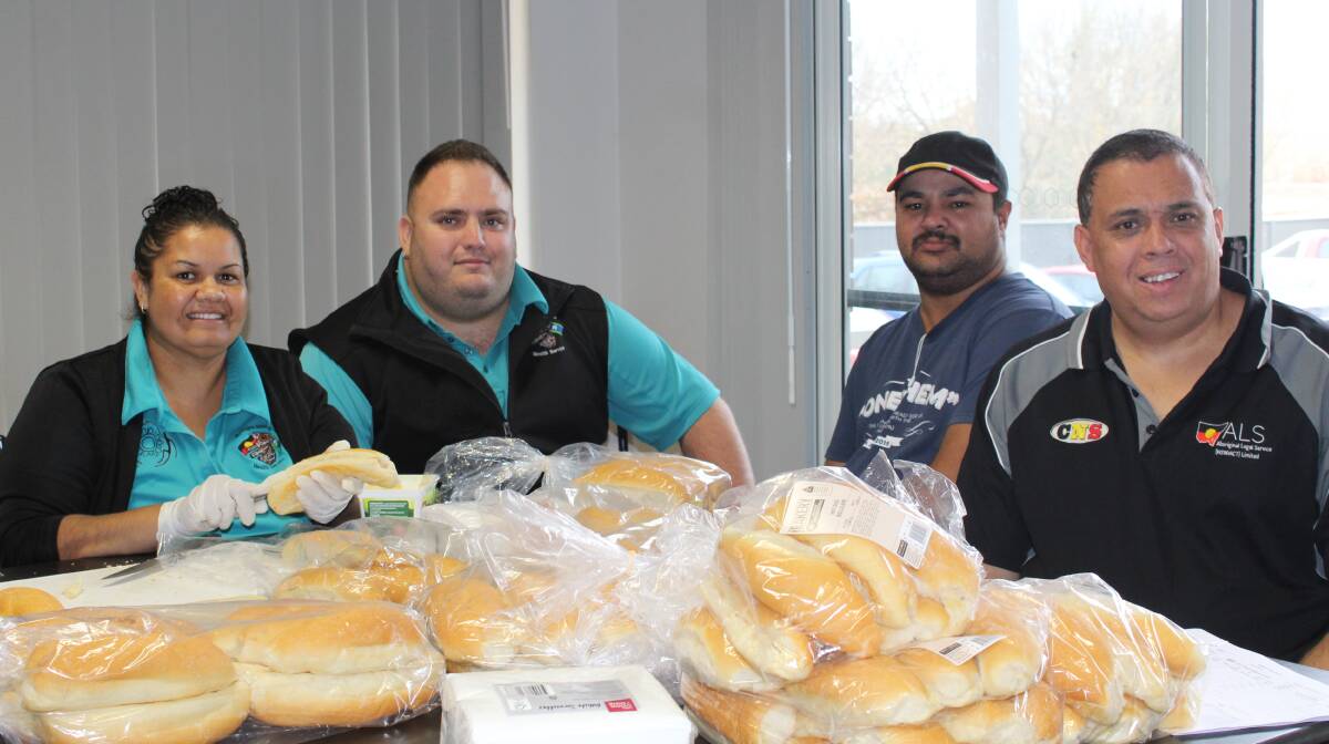 WORKERS: Alicia Moran, Jonny Falzon-McClure, Andrew Boney and Kevin Green at work buttering some buns.
