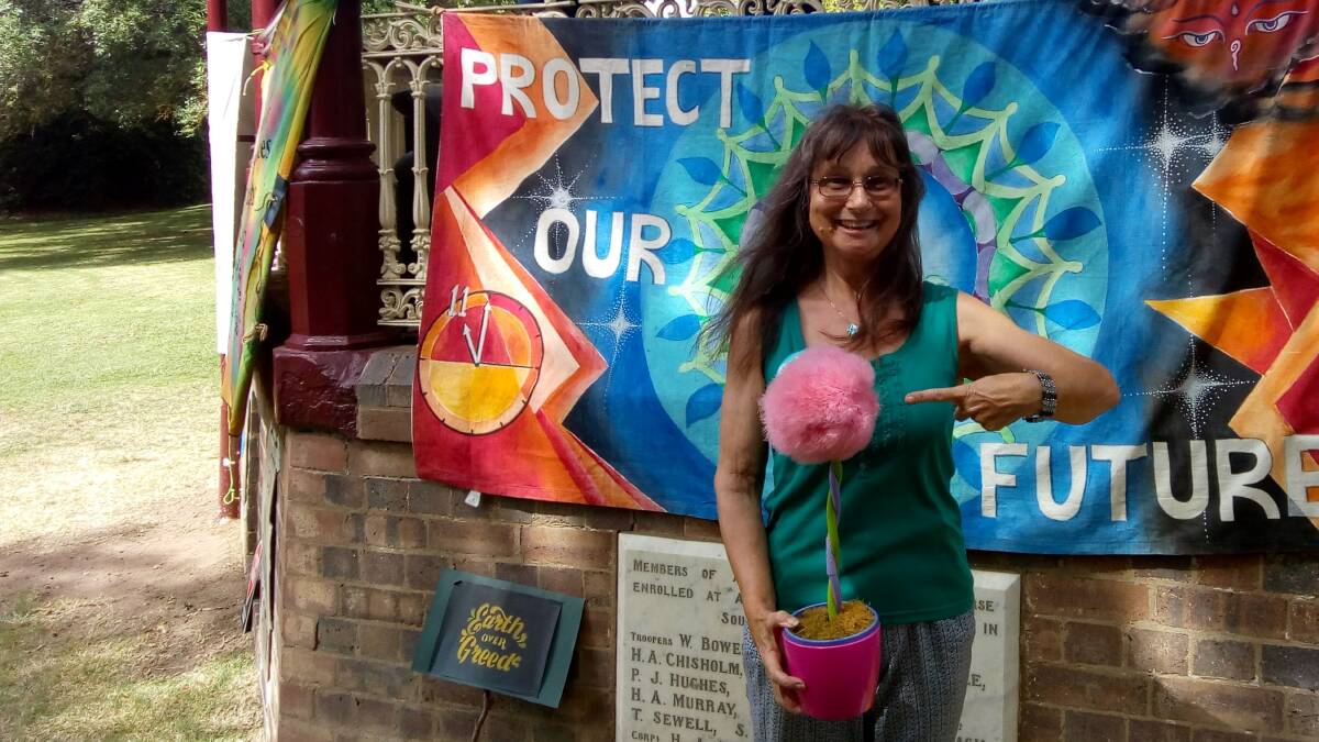 Cr Dorothy Robinson shows her support at Armidale's Strike4Climate with a Truffla Tree from The Lorax.