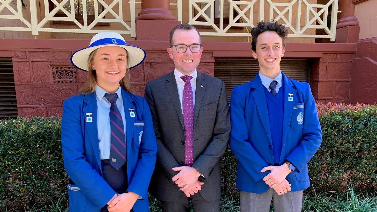 LEADERS: From OConnor Catholic College student leaders Meg Lye and Simon Di Luzio with Adam Marshall.