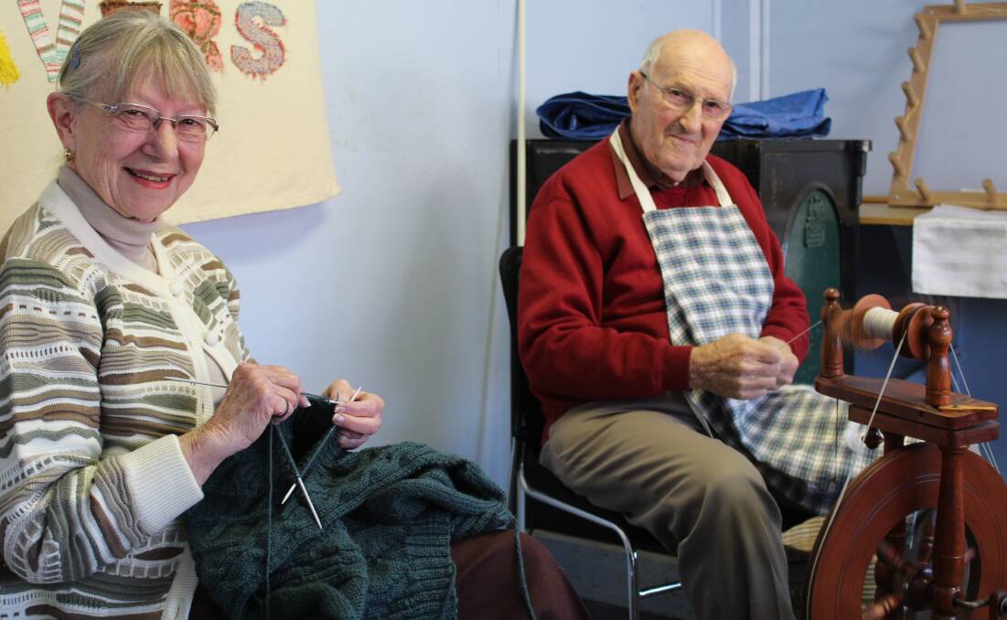 FOUR DECADES: Merryn Twemlow and Ian Lockrey kept busy with wool.