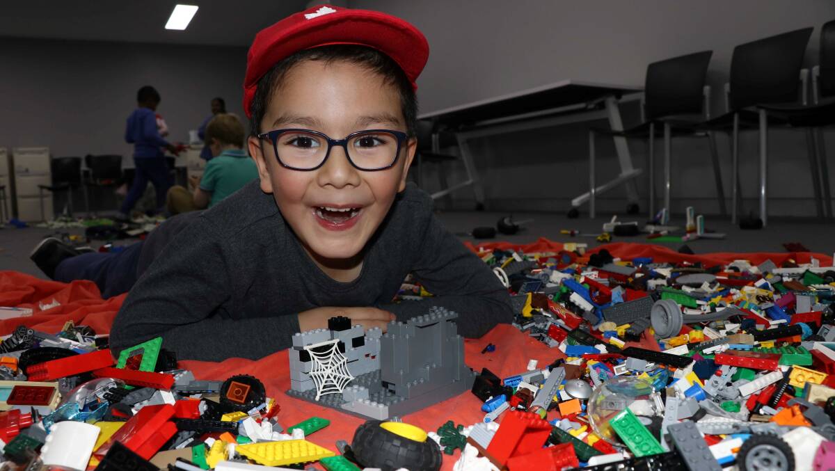 WOW!: Rueben gets creative at a previous Lego free play session at the Armidale Regional War Memorial Library.