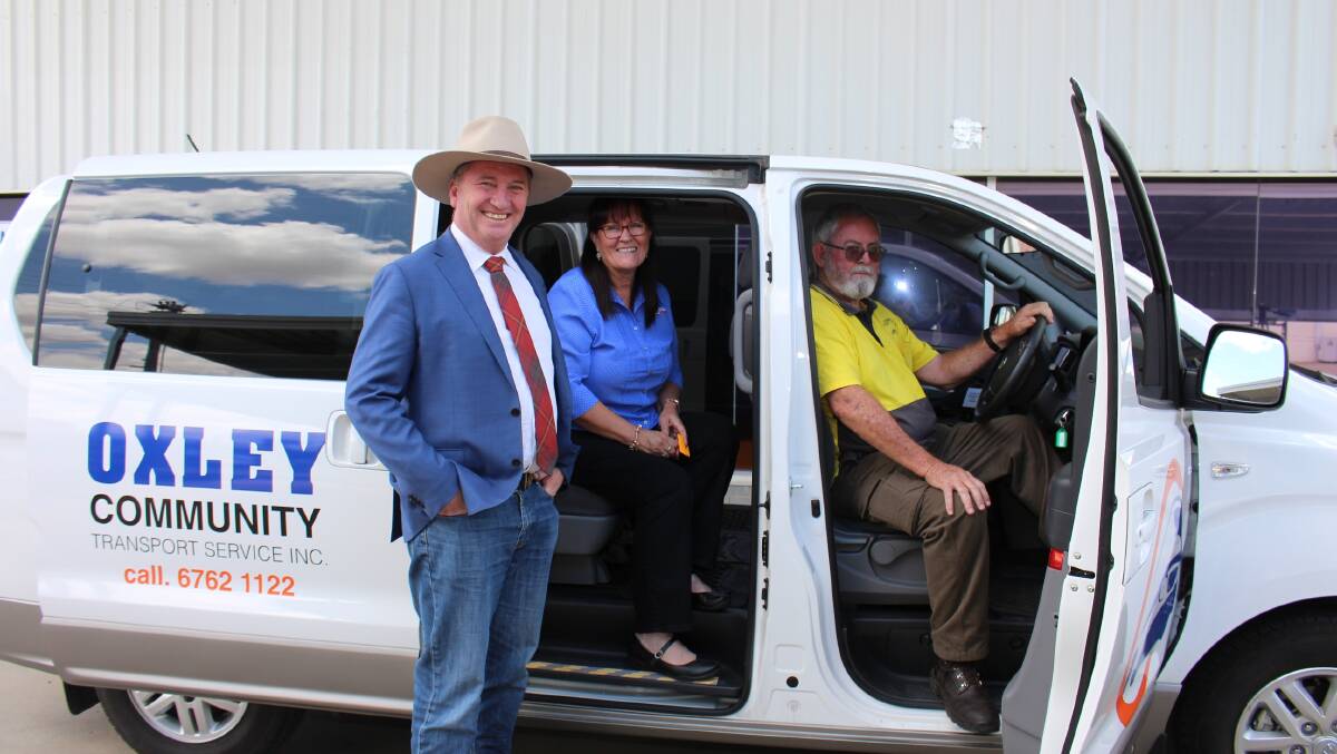 FUNDED: Mr Joyce with Oxley Community Transport Service members one of the many local organisations awarded grants under the Stronger Communities Program.