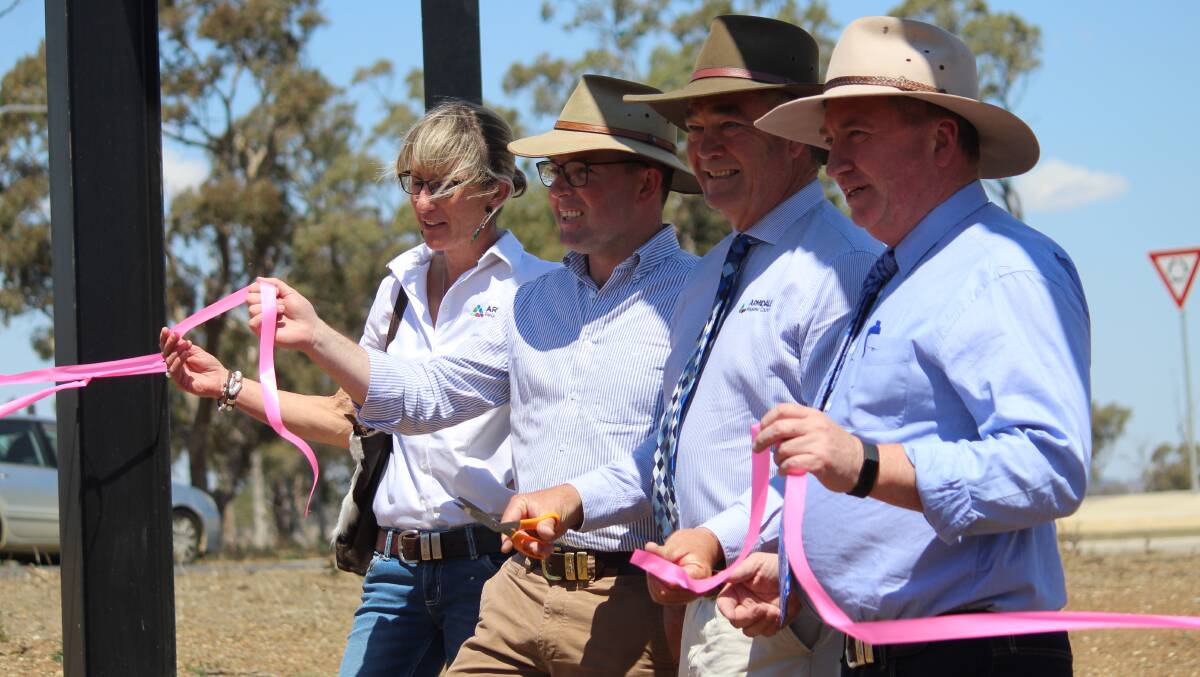 CUTTING: ArmidaleRegional Council deputy Mayor Libby Martin, Member for Northern Tablelands Adam Marshall, Mayor Simon Murray and Member for New England Barnaby Joyce cut the ribbon to officially open the airport roundabout.