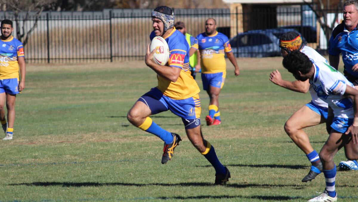 BREAK: John Roberts runs the ball for Narwan. Roberts was a prolific try scorer in Saturday's match against the Moree Boars.