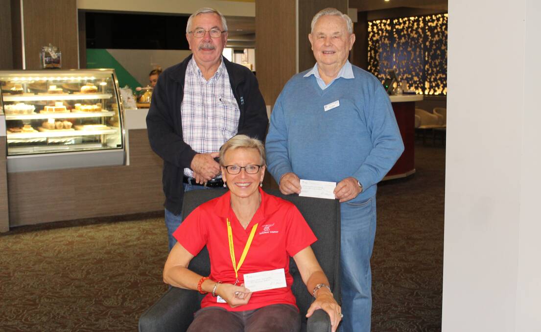 DONATION: President of Armidale & District National Servicemen's Association Barry Dawson with Westpac Rescue Helicopter volunteer Pam Pateman (seated) and president of St Joseph's Conference St Vincent de Paul Don Hewitt.
