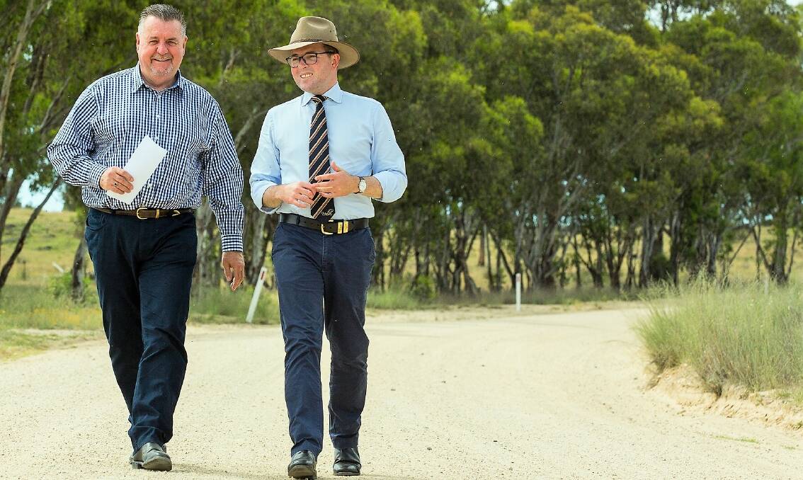 GOOD NEWS STROLL: Uralla Shire Council Mayor Mick Pearce with Northern Tablelands MP Adam Marshall pace out the soon-to-be sealed section of Bingara Road on Monday morning.