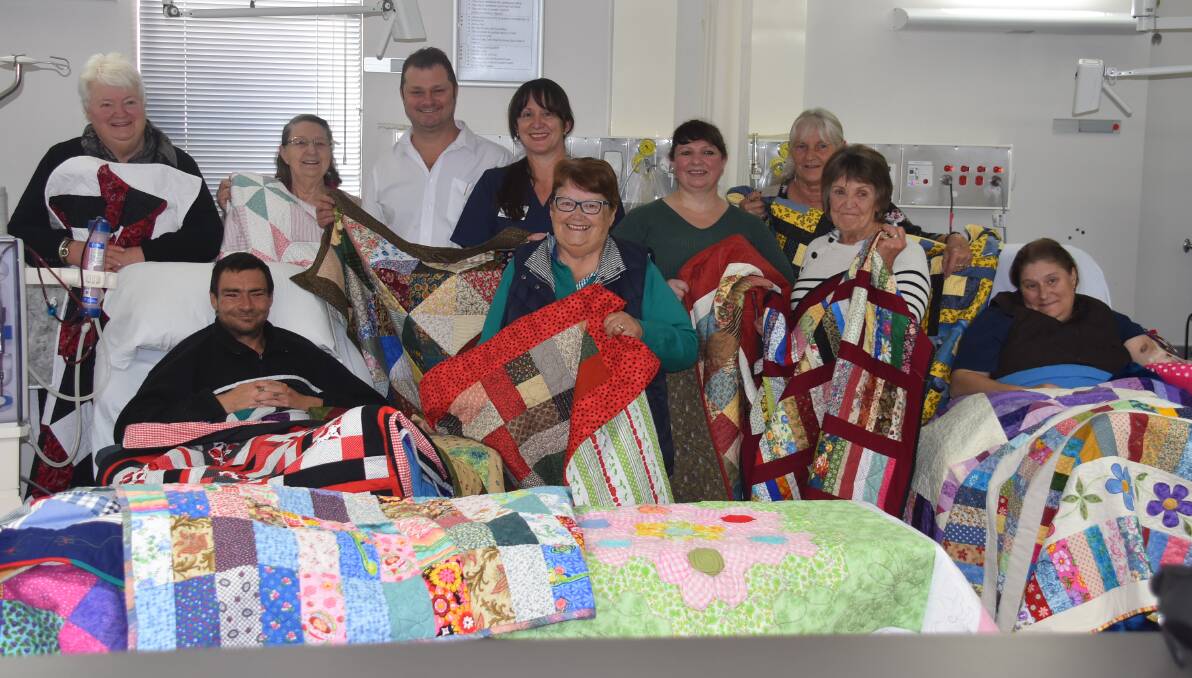 Ladies from U3A handed over quilts to the Armidale Hospital Renal Unit this morning (l-r) Beryl Death, patient Craig Parker, Kate Hayward, director of nursing and midwifery Hamish Yeats, Nursing manager Tina Staker, Robyn Curry, Naomi Haywood, Beryl Jordan, Margaret Boundy and patient Jeanie Barnsworth.