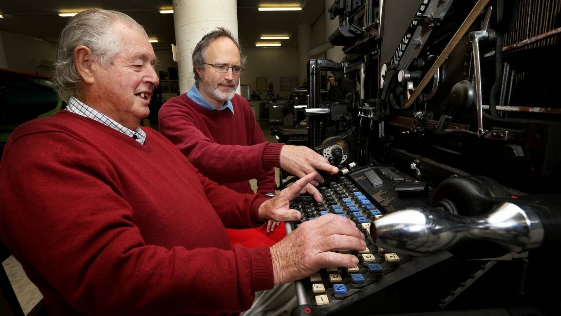 REMINISCING: Armidale Museum of Printing curator Benjamin Thorn and former printer operator Keith Dubber, who has 50 years of industry experience in printing, take a look at one of the museums printers.
