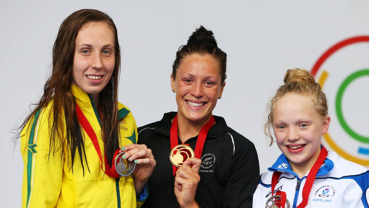 Gold medallist Sophie Pascoe of New Zealand poses with silver medallist Madeleine Scott of Australia and bronze medallist Erraid Davies of Scotland during the medal ceremony for the Women's 100m Breaststroke SB9 Final. PICTURE: GETTY