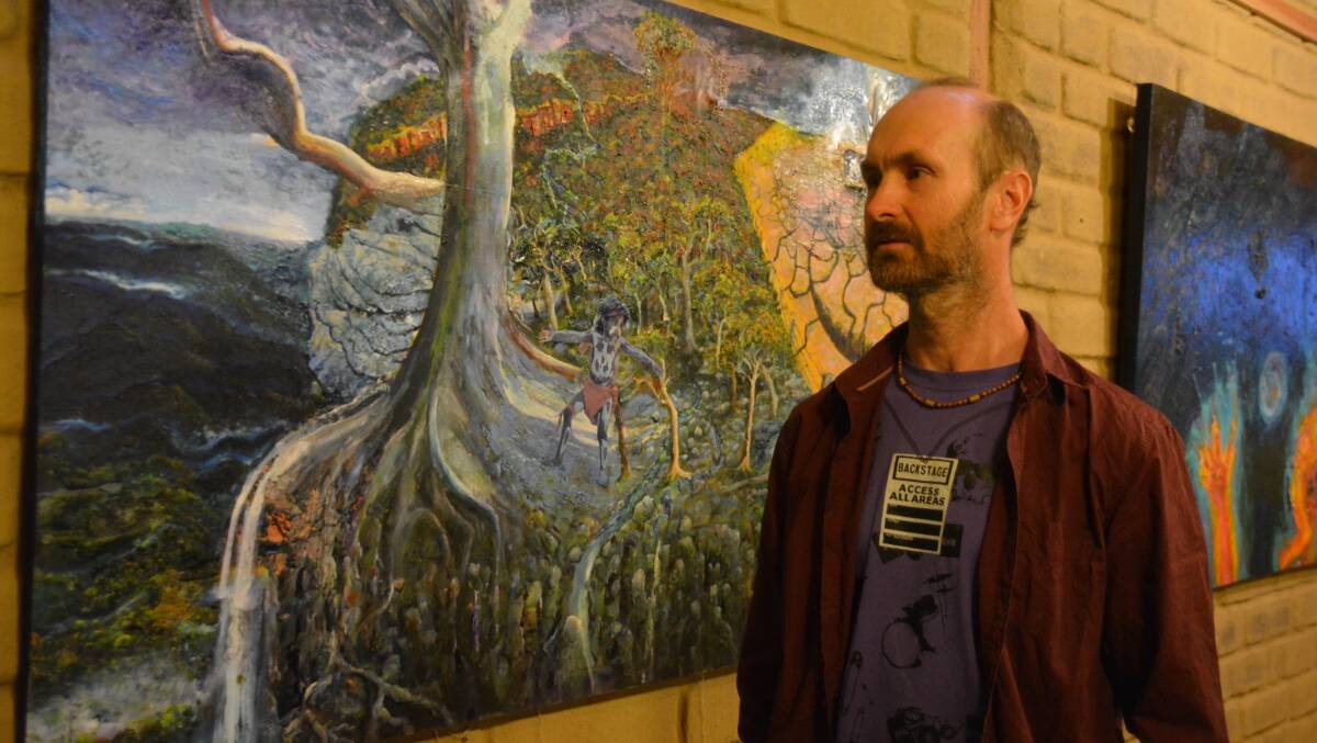 ENVIRONMENT THEME: Artist Marty Branagan at the Global Warning exhibition, which can be viewed at the Woodlands Centre in Mann Street.