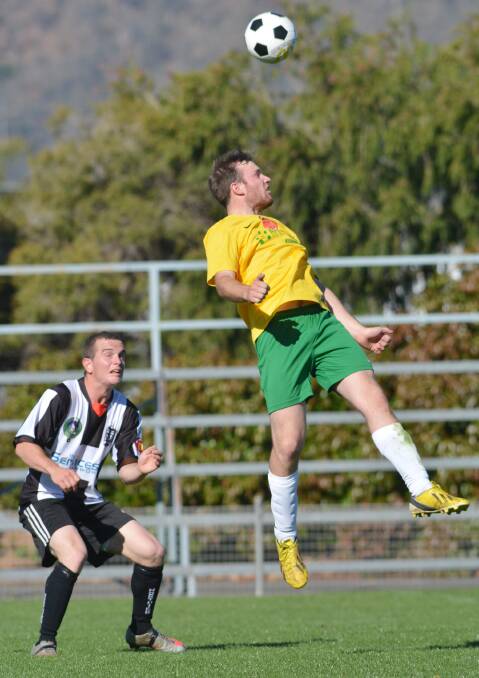 AIRBORNE: South Armidale’s Jake Graham rises above North Companios’ Nick Bowden on Saturday. Graham also booted a goal.