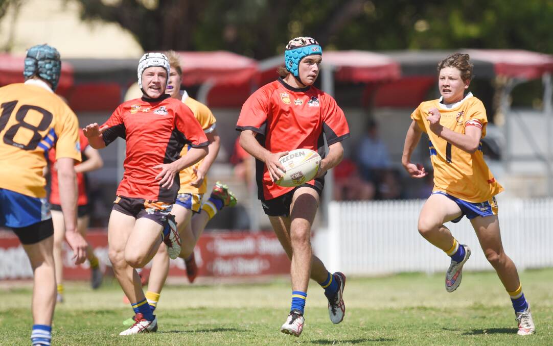 Gunnedah’s Luke Howes on the burst with Jed Englert in support and Jacob Button (right) cover defending. Howes and Englert have been named in the 41-player GNA squad that will be inducted on October 31.  Photo: Barry Smith 101015BSH26