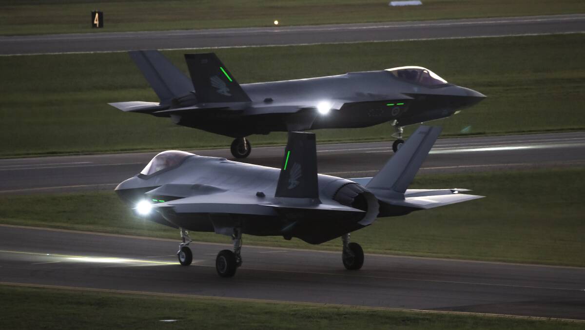 F-35 Joint Strike Fighters taxi out for a night sortie from RAAF Base Williamtown. Picture: Department of Defence