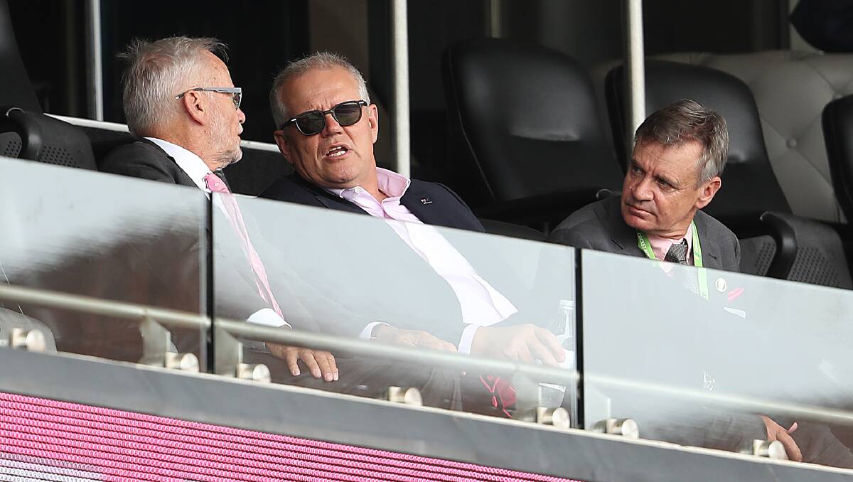 Prime Minister Scott Morrison (centre) watches day three of the fourth Test in the Ashes series between Australia and England. Picture: Getty Images