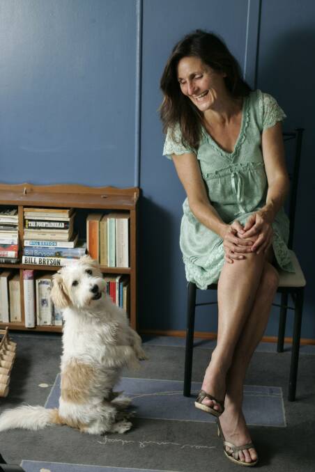 STAR: Lloyd the dog does his meerkat trick. Also pictured is journalist and columnist, Joanne McCarthy.