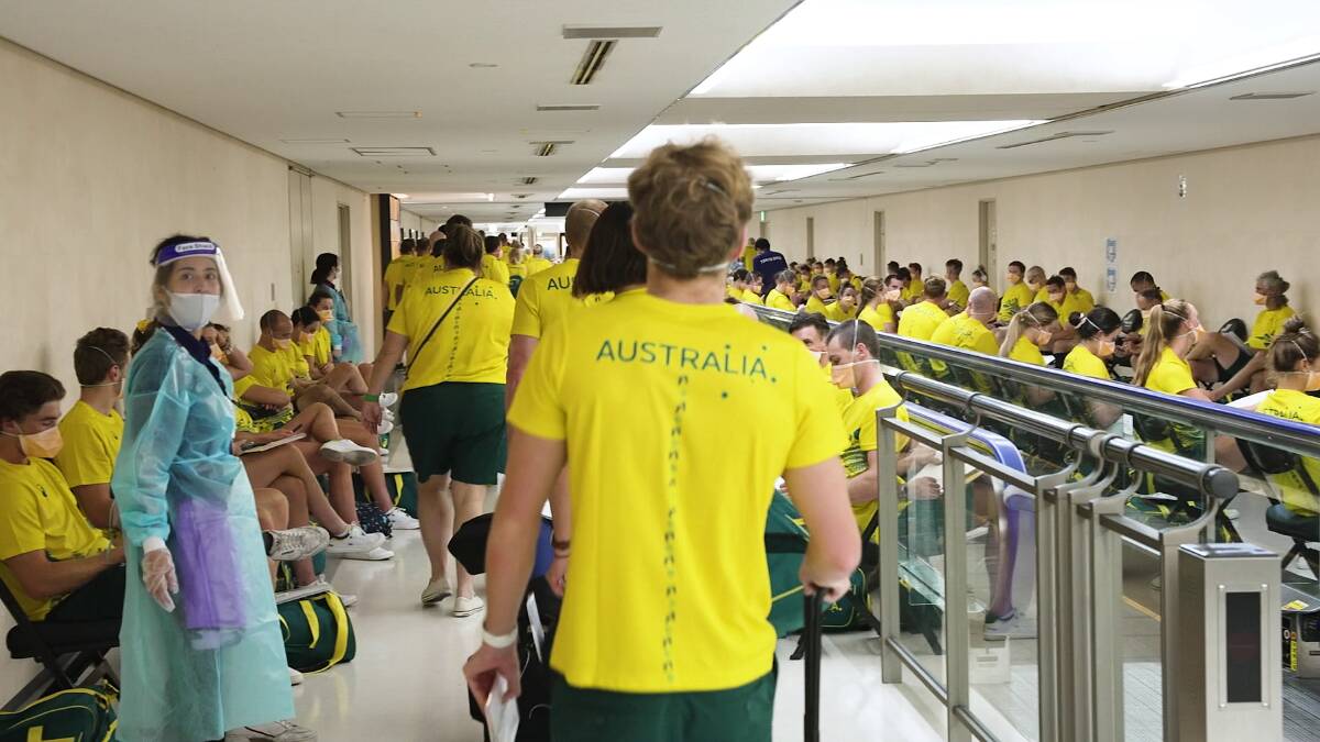 MASKS ON: Australian athletes after arriving at Narita airport in Tokyo, Japan, on the weekend. Picture: AAP