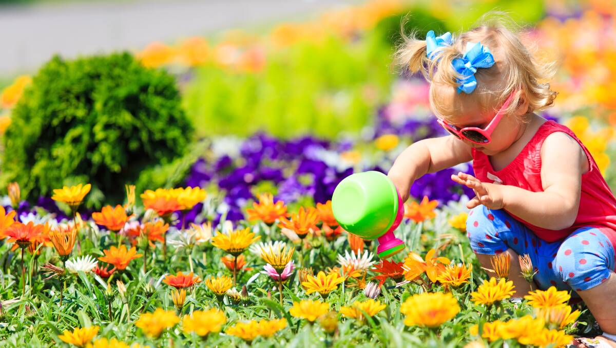 Budding gardener: Working in a garden can help children learn a whole range of skills and build strong relationships.