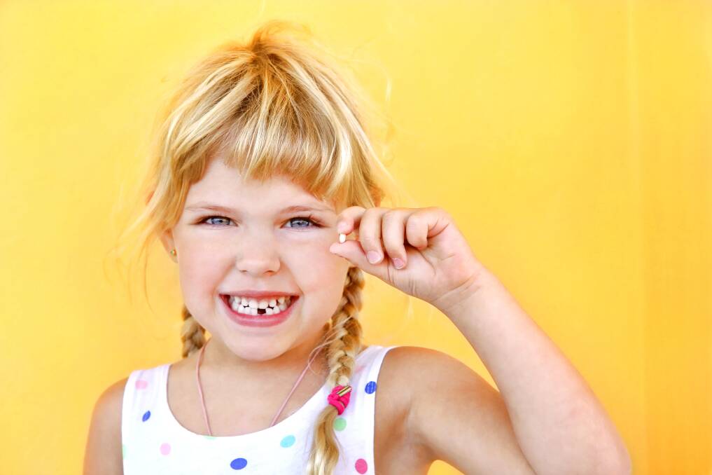 Ta-da!: For children, a loose tooth simply means an exciting visit from the tooth fairy.