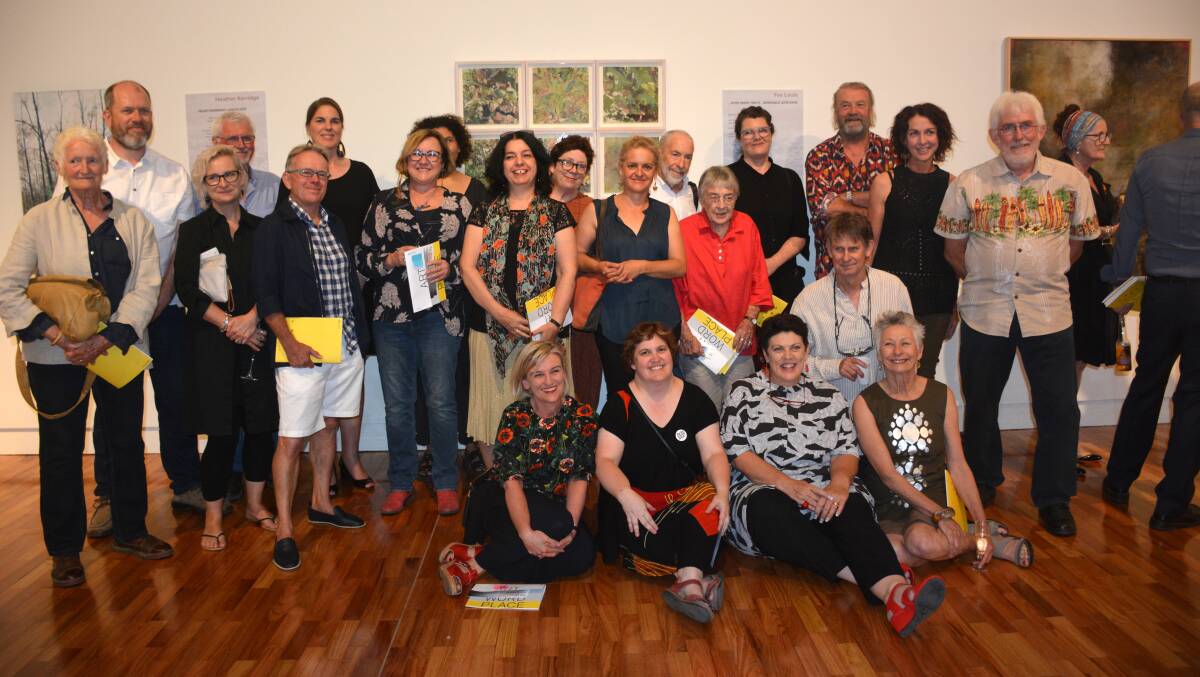 Art and text: Curator Caroline Downer (front, second from left) with some of the artists and writers whose works are part of Art Word Place at the exhibition opening earlier this month.