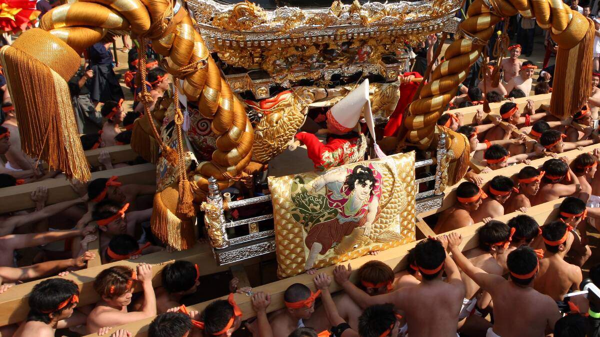 Japanese Shrine Parishioners of Matsubarai and Nakamura shrines, jolt their Yatai, (portable shrines) against one another during a parade as part of the Nada No Kenka Matsuri. Photo: GETTY IMAGES