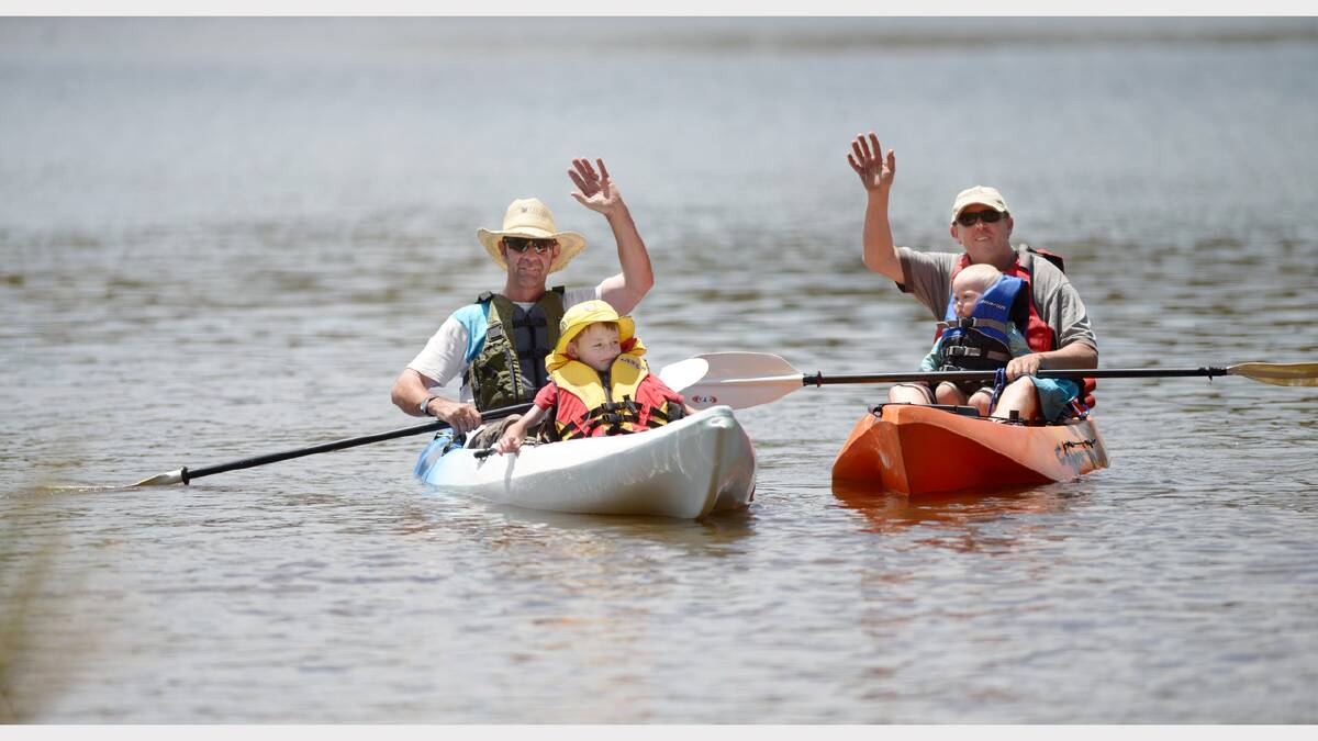 SUMMER FUN: Peter Heagney and his son Rhett, 7, with Glencoe’s Stephen Newberry and his 18-month-old son Alec paddling on Dumaresq Dam.