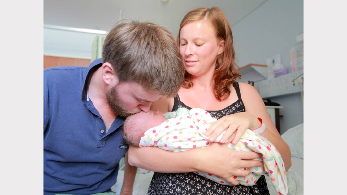 FAMILY FIRST: David Harvey and Rebecca Adams get to know little Addison Grace.